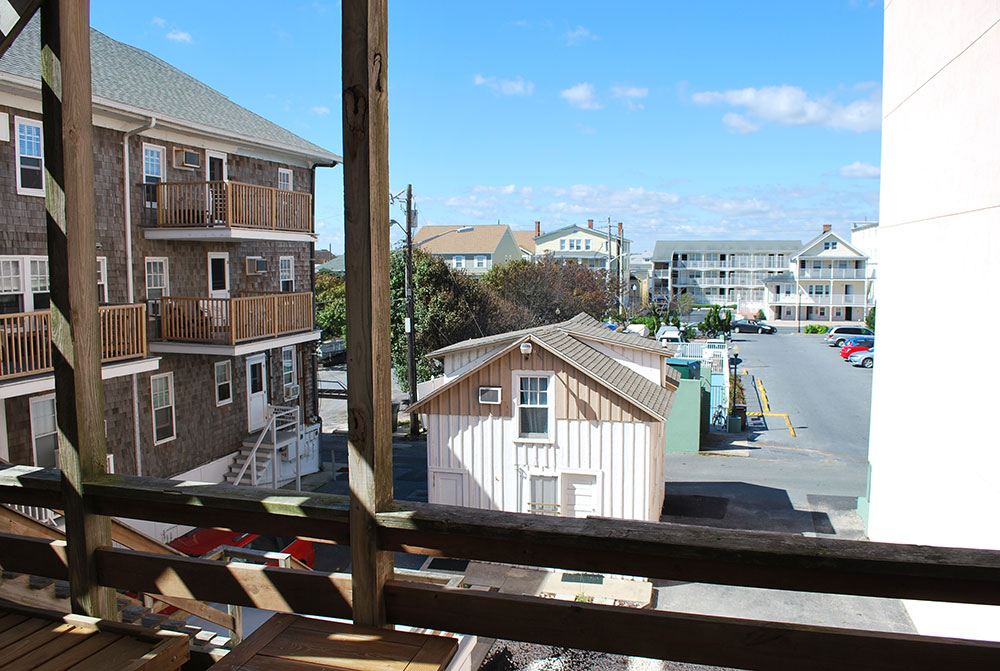 a view of a street and buildings from a balcony