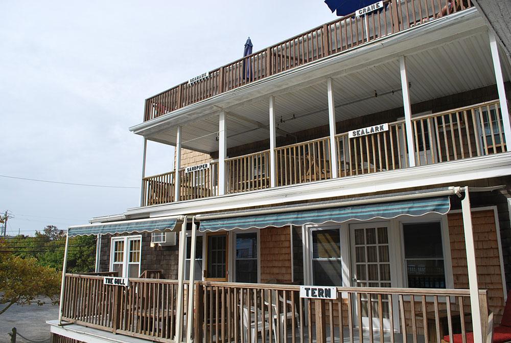 a house with two balconies and a balcony