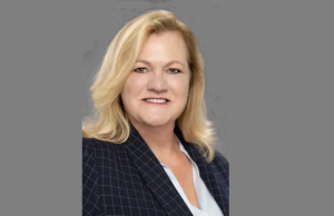 a woman in a business suit posing for a picture