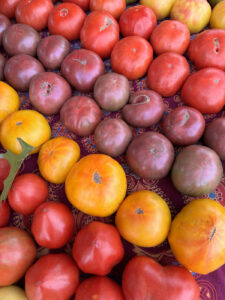 a table topped with lots of different types of fruit