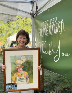 a woman holding up a picture of a child
