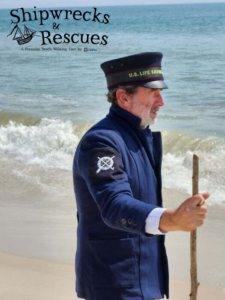 a man in a blue uniform standing on a beach