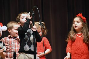 kids at microphone on stage