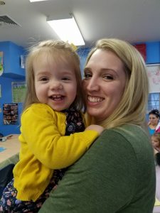 mom smiling with toddler