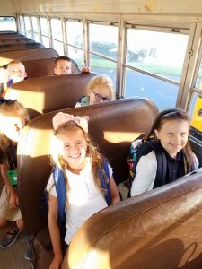 two girls on school bus
