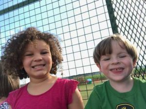 two kids smiling