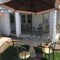 apartment backyard with table and chairs with canopy