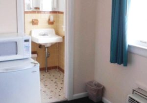 bedroom with kitchenette and bathroom
