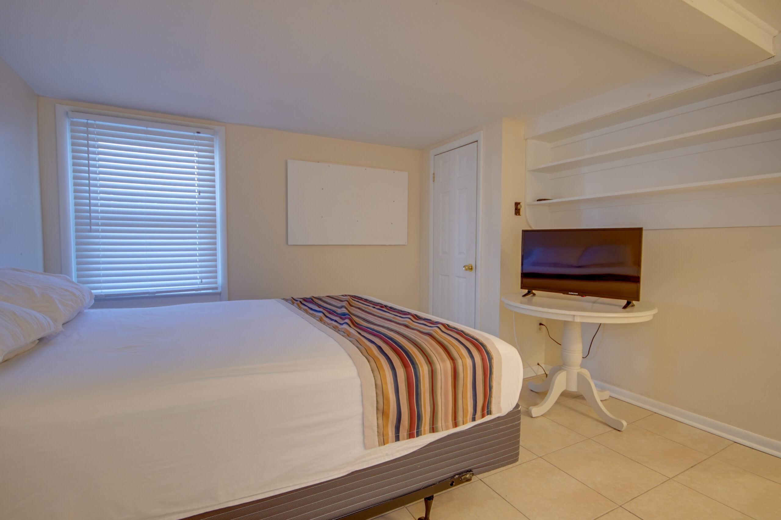 unit 5 bedroom with television