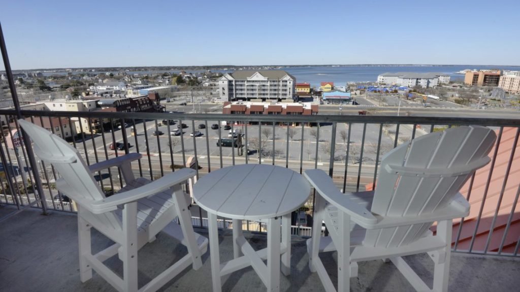 balcony of hotel room with table and chairs
