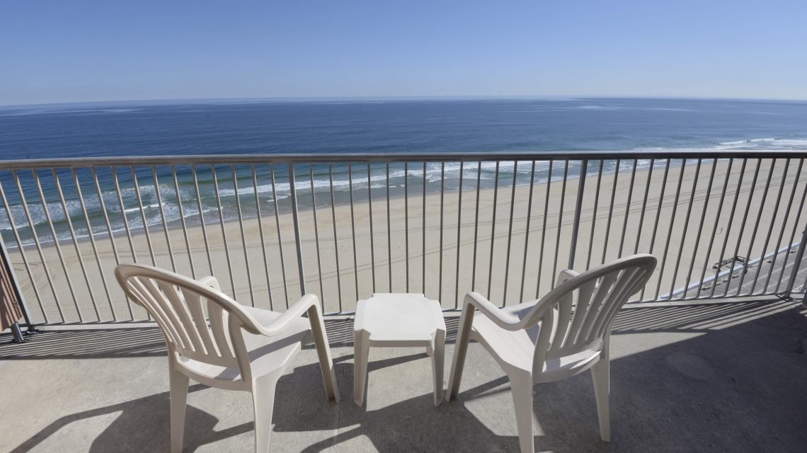 balcony view with tables and chairs