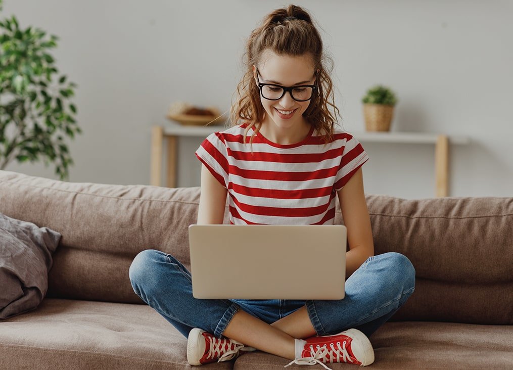 female sitting working laptop