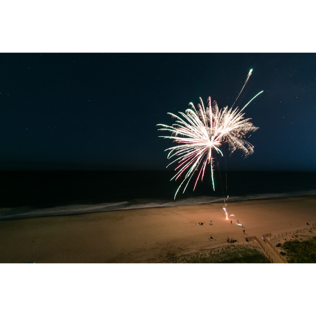 Fireworks in the sky over the ocean