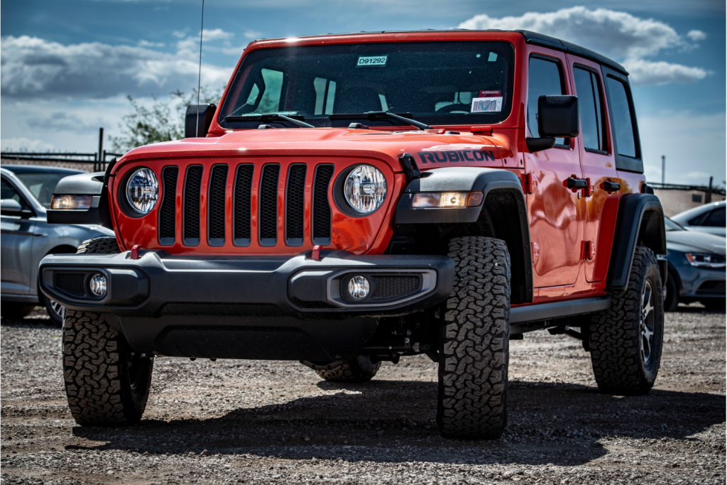 Red Jeep in a parking lot