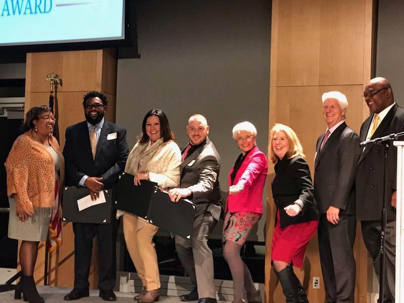 2018 entrepreneur of the year finalists and officials posing on stage