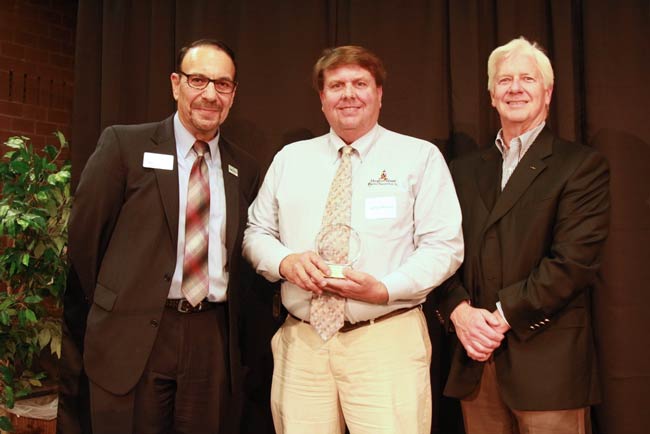 2016 entrepreneur of the year with award and officials posing
