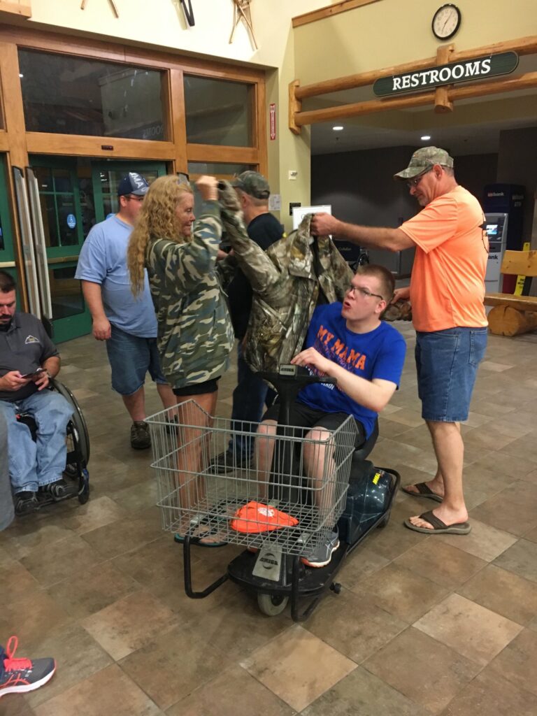a group of people standing around a shopping cart