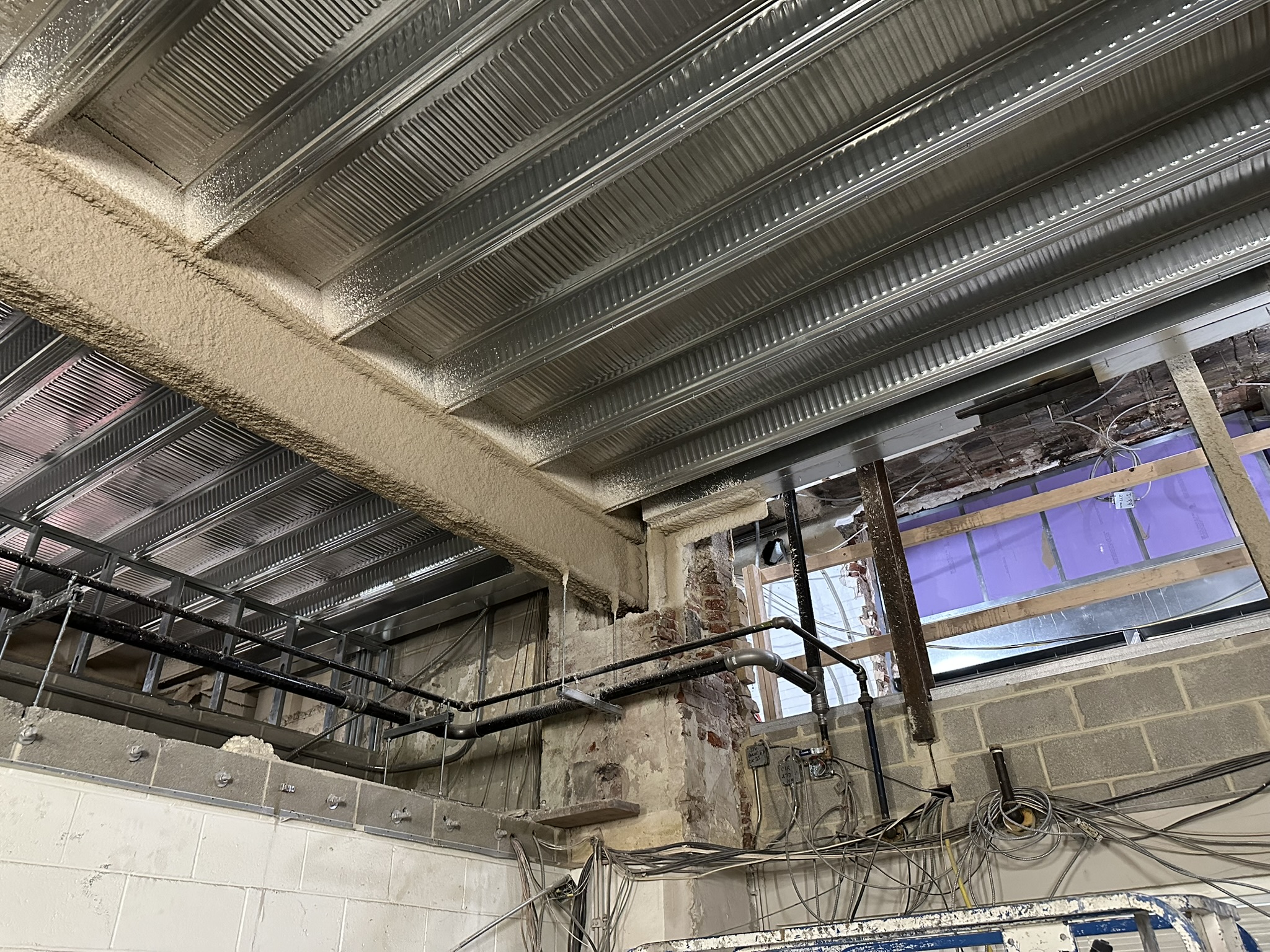 Bellevue Bathhouse Renovation Reaches Key Structural Milestone in Philadelphia View of new metal deck/framing and existing structure coordination inside Bellevue Bathhouse renovation.