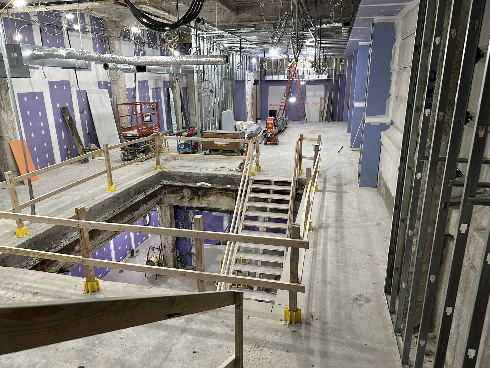 Bellevue Bathhouse Renovation Reaches Key Structural Milestone in Philadelphia Wide view of Bellevue Bathhouse renovation interior with temporary guardrails and active construction.