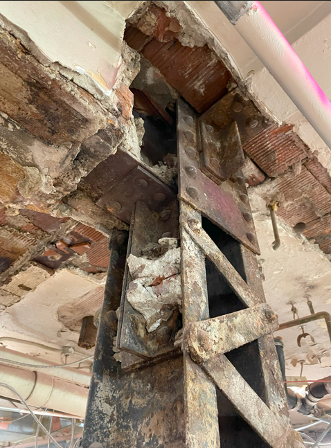 Bellevue Bathhouse Renovation Reaches Key Structural Milestone in Philadelphia Close-up of existing structural steel connection and surrounding masonry/ceiling conditions during renovation.