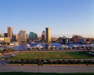 a city skyline with boats in the water