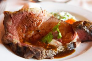 Prime rib served with sauce