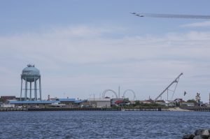 overview of ocean city inlet with blue angels flying through the sky