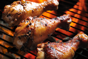 chicken wings on flaming grill