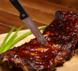 bbq ribs on a wooden cutting board