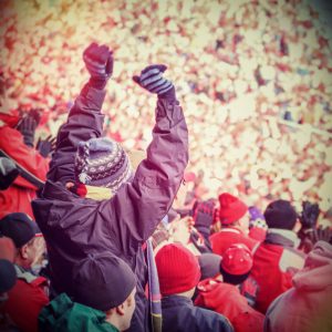 person cheering at football game