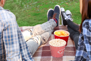 Young Couple Watching Movie in Outdoor Cinema