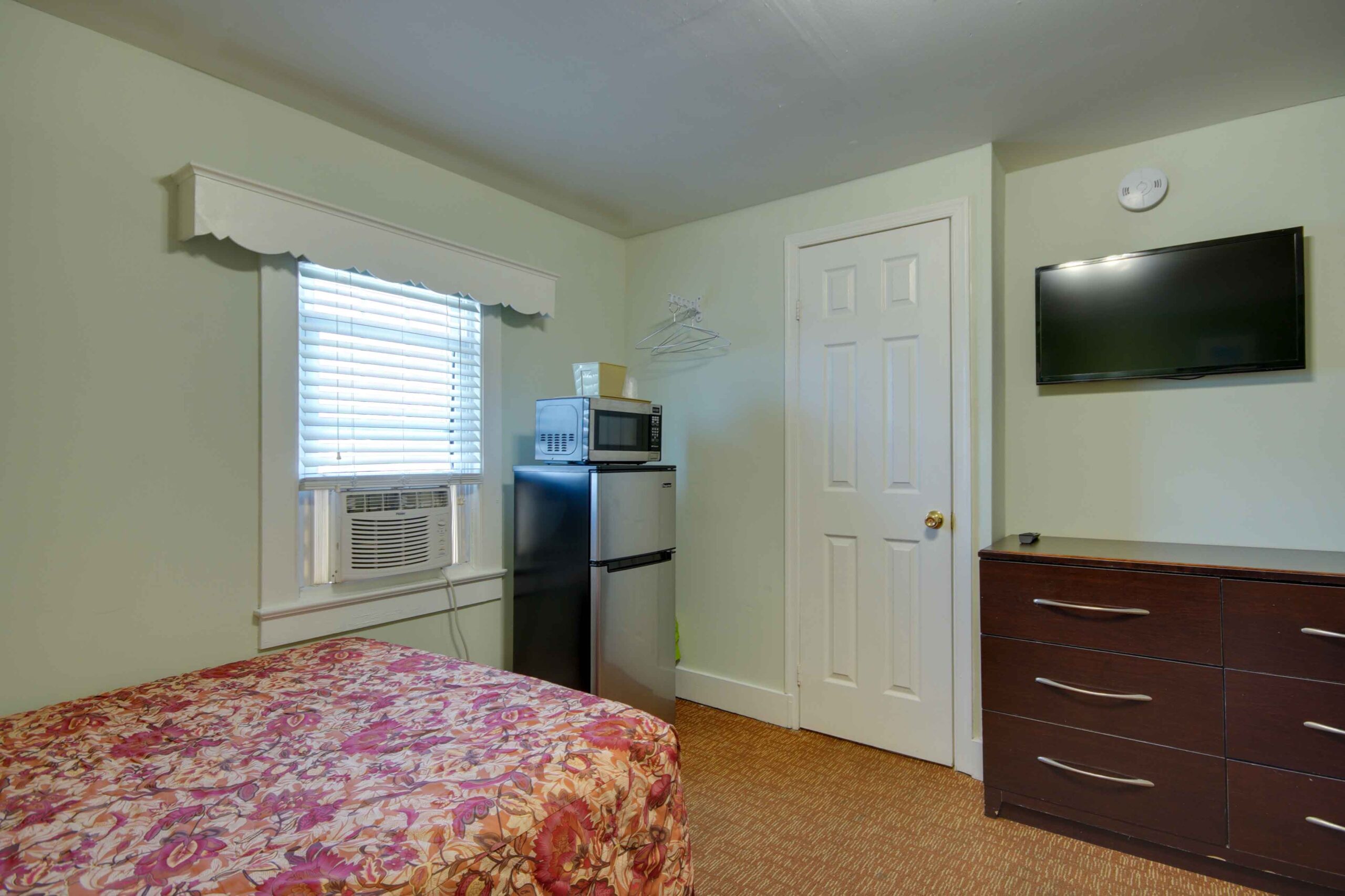 hotel room with fridge