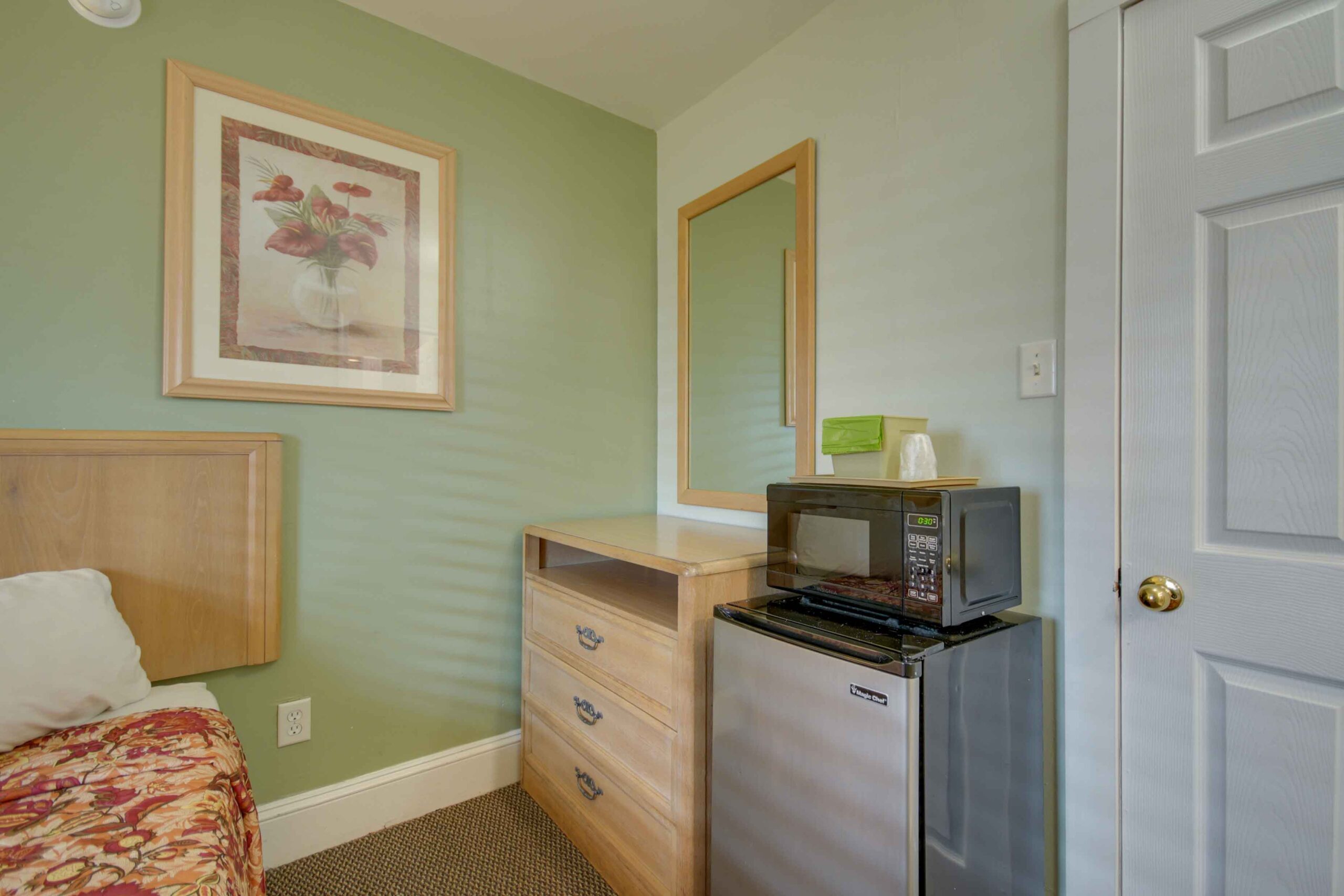 hotel room with microwave and fridge