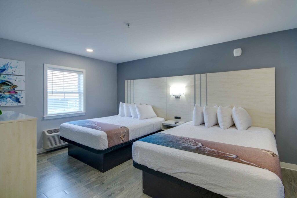 hotel room with two queen beds