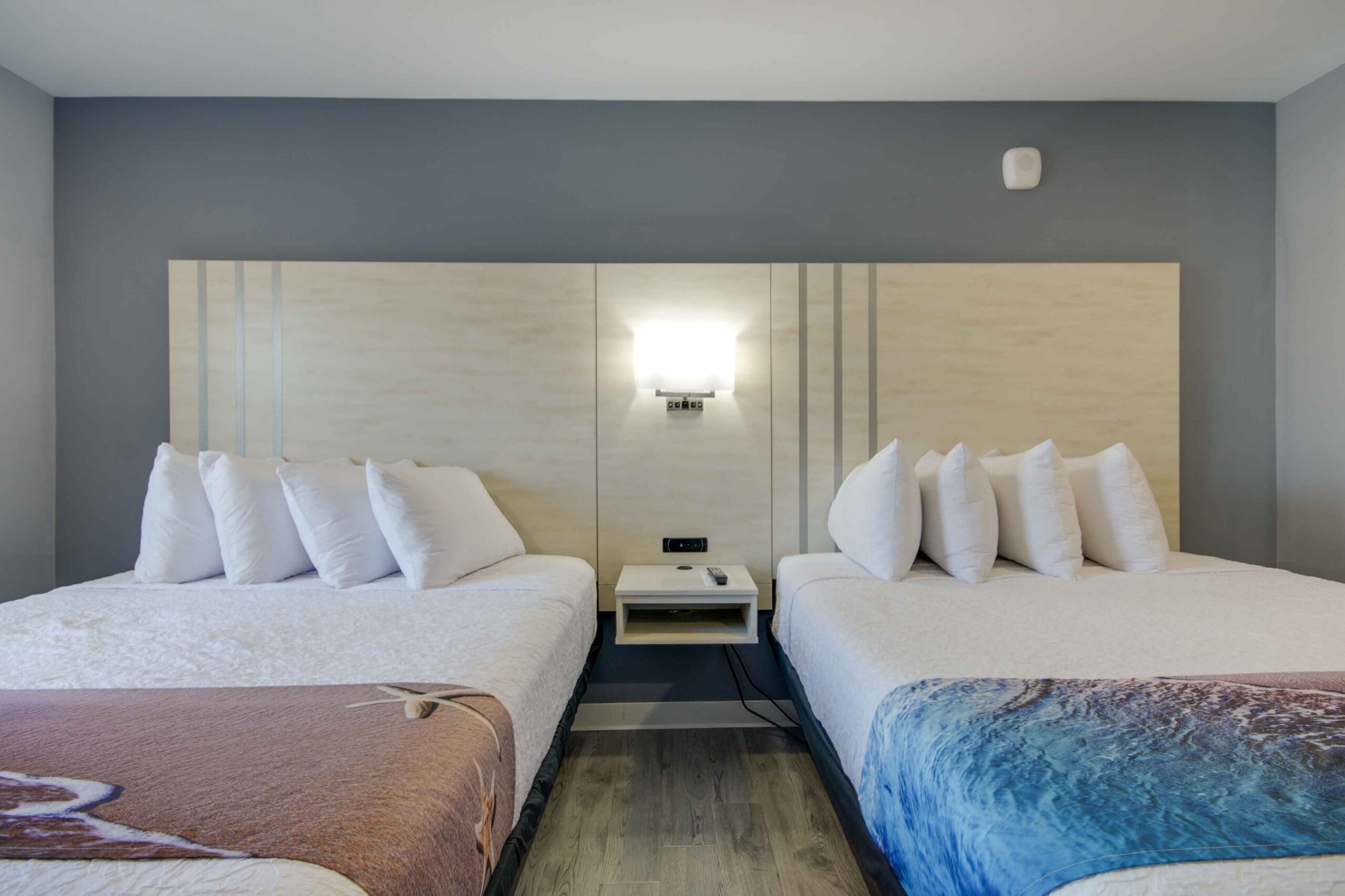 hotel room with two queen beds