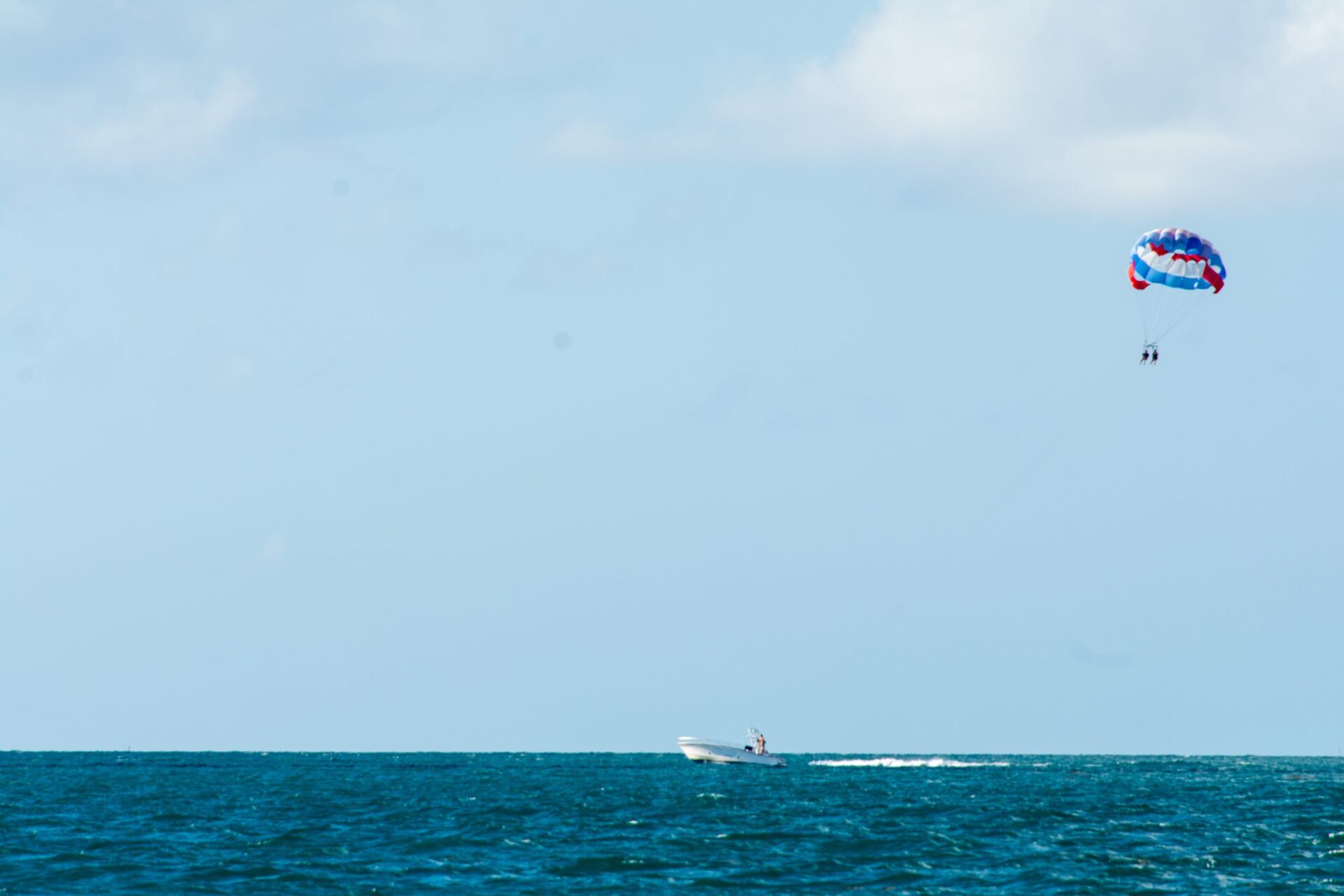 Parasailing over open water