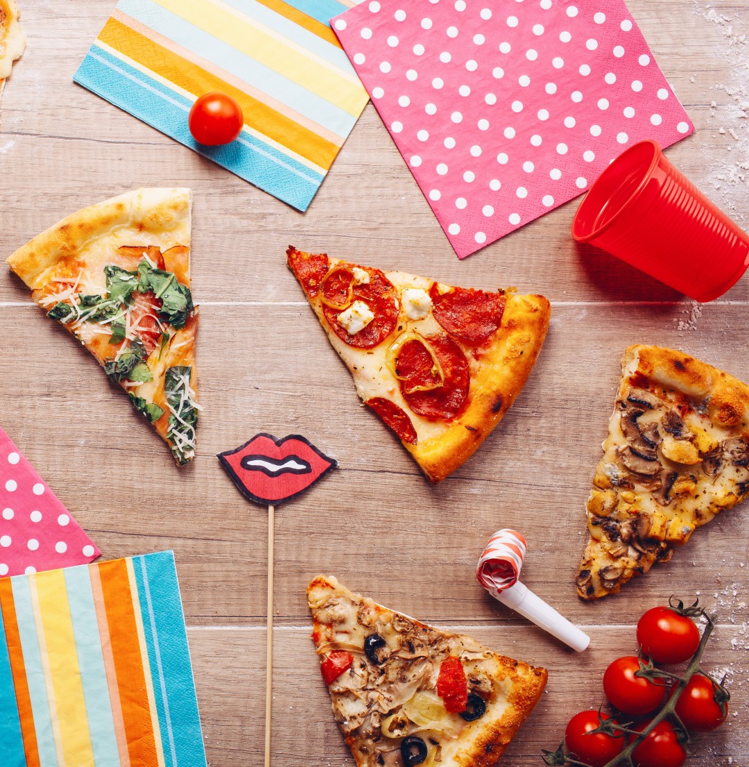 Pizza party with decorations and pizza slices