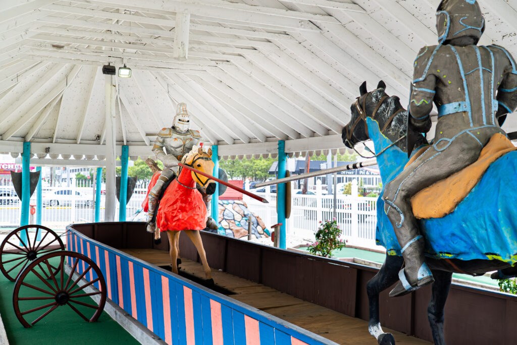 a couple of statues of knights riding on top of horses
