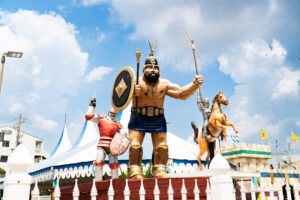 a statue of a man holding a sword and shield