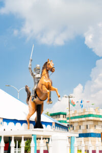 a statue of a man riding a horse