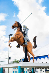 a statue of a man riding a horse