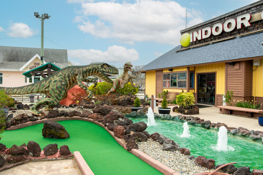 a miniature golf course in front of a store