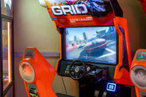 a video game machine with a racing game on the screen