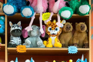 a shelf filled with lots of stuffed animals