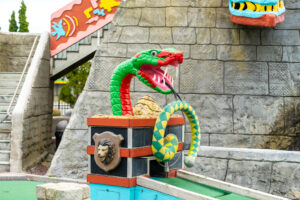 a fake dragon on top of a pirate ship