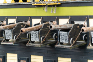 a row of metal objects hanging on a wall