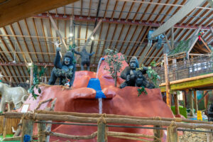 a group of statues of animals in a building
