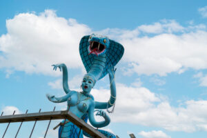 a statue of a woman with a snake on her head