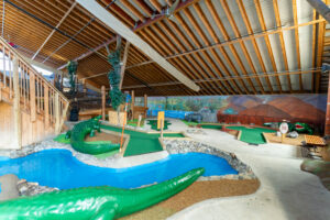 a large indoor play area with slides and slides