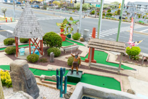 a miniature golf course on a street corner